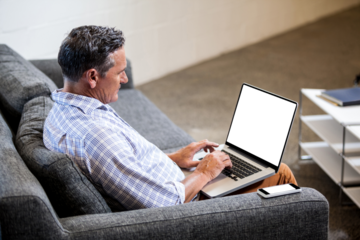 Profile view of a businessman working on computer