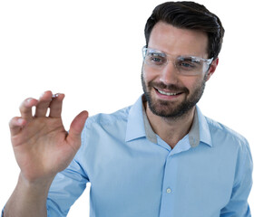 Man wearing protective eyewear pretending to touch invisible object
