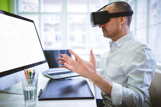 Casual businessman using virtual reality device