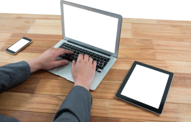 Businessman using laptop at table