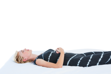 Attractive blond woman napping on bed