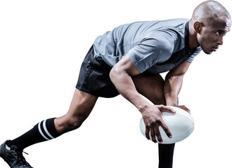 Determined athlete bending while playing rugby