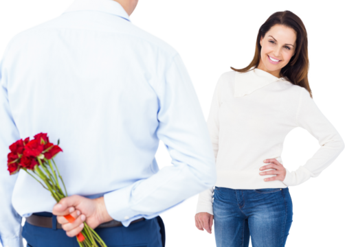 Rear view of man hiding roses behind back from woman