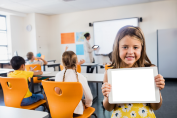 Smiling girl holding standing in classroom