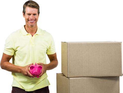 Portrait of smiling man holding pink piggy bank