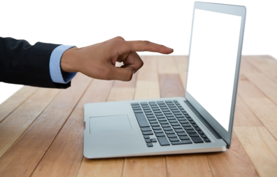 Cropped hand of businessman pointing into laptop