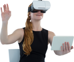 Female executive holding digital tablet while using virtual reality headset