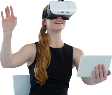 Female executive holding digital tablet while using virtual reality headset
