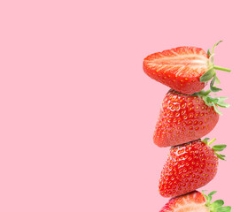 Stack of fresh strawberries on pink background, space for text