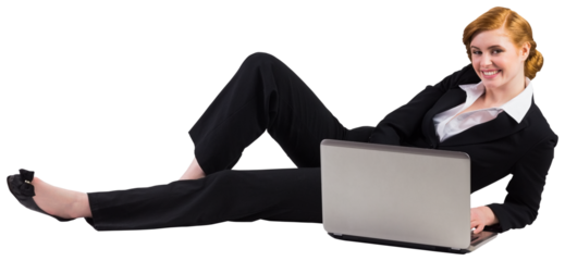 Redhead businesswoman using her laptop