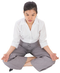 Businesswoman sitting in lotus pose