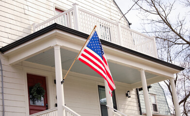 The US flag on a pole is a symbol of patriotism and unity, representing the country's values, history, and people. Its design and colors have symbolic meaning