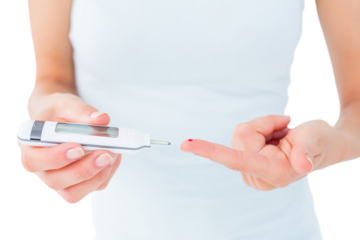 Woman testing her blood glucose level 