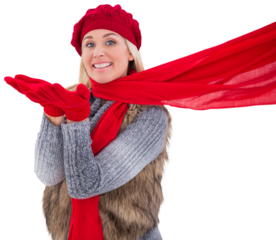 Blonde in winter clothes blowing kiss