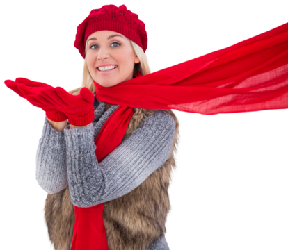 Blonde in winter clothes blowing kiss