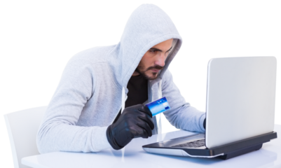 Burglar doing online shopping with laptop and credit card