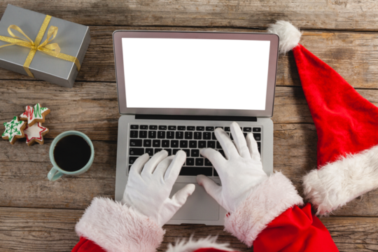 Santa Claus using laptop at home