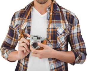 Mid section of hipster using camera