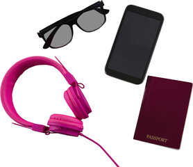 Mobile phone, passport, sunglasses and headphones