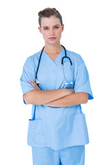 Serious nurse looking at camera with arms crossed