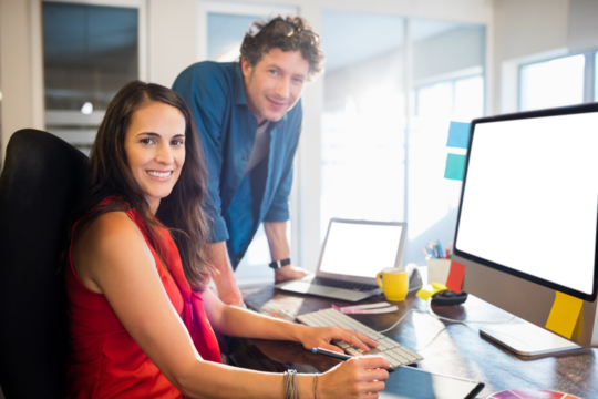 Business people working in office using technology - Powered by Adobe
