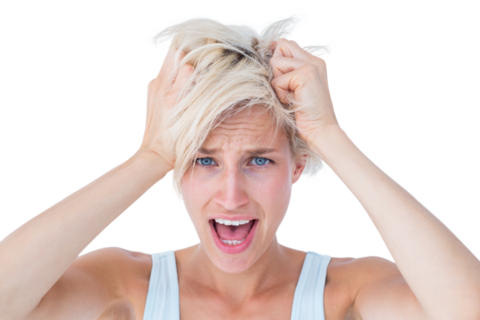 Stressed woman screaming and holding her head 