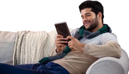 Smiling man using digital tablet on sofa