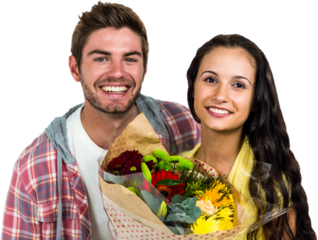 Happy couple holding bouquet and smiling at camera
