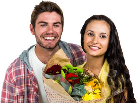 Happy couple holding bouquet and smiling at camera