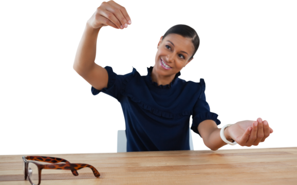 Businesswoman pretending to work on an invisible object