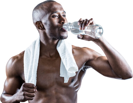 Fototapeta Athlete with towel around neck drinking water