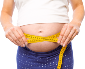 Pregnant woman measuring her bump