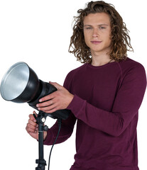 Portraot of young photographer holding focus light