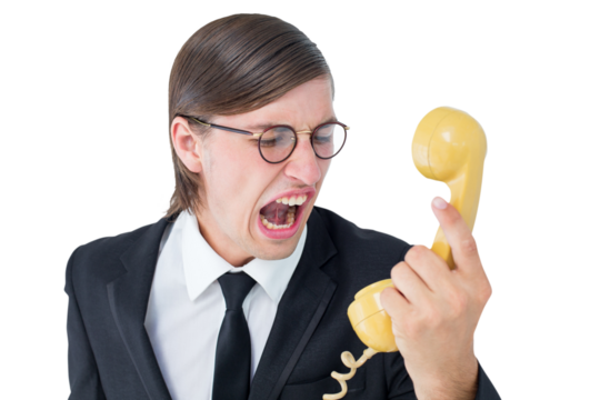 Geeky businessman shouting at retro phone 