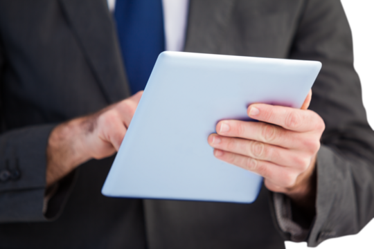 Businessman scrolling on his digital tablet