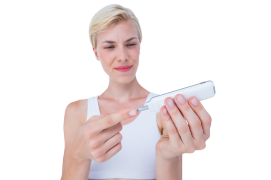 Woman doing test with blood glucose monitor