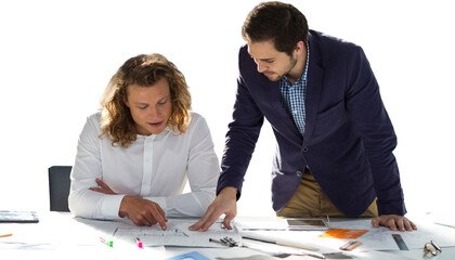 Colleagues discussing at table against white background