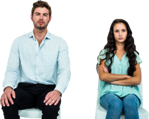 Couple sitting on chairs not talking after argument
