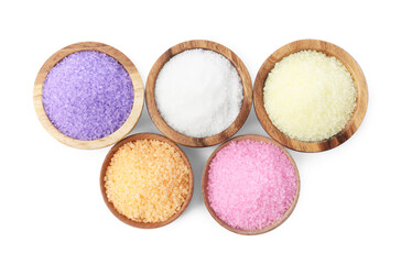 Wooden bowls with different sea salt on white background, top view