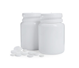 Two bottles with pills on white background
