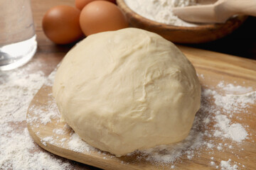Cooking scones with soda water. Dough and ingredients on wooden table, closeup
