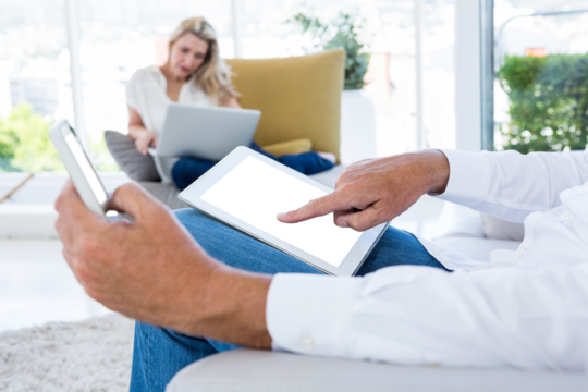 Man using digital tablet and mobile phone