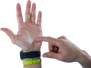 Hands of man wearing watch and fitness band pretending to use invisible phone