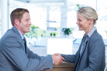 Business people shaking hands in office