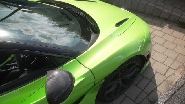 Green sport car standing on the parking spot
