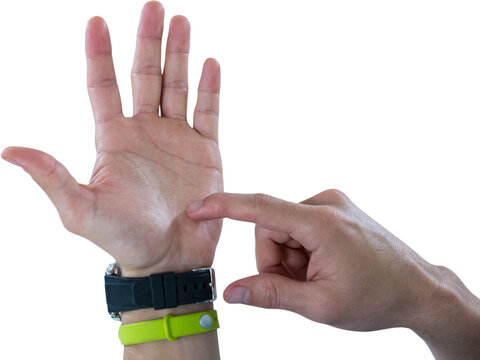 Hands of man wearing watch and fitness band pretending to use invisible phone