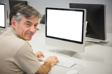 Portrait of smiling man using computer