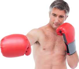 Fit man punching with boxing gloves