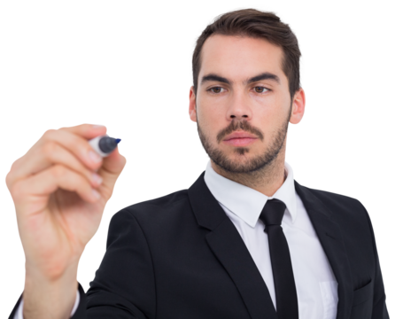 Focused businessman writing with marker