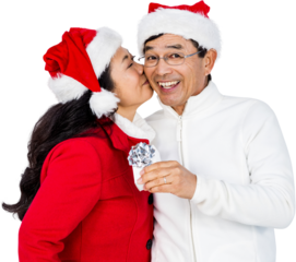 Festive senior couple exchanging gifts